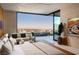 Luxurious main bedroom with a large window offering mountain views at 4918 Summit Overlook Dr, Las Vegas, NV 89135