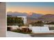 Outdoor seating area featuring a fire pit and stunning mountain views at 4918 Summit Overlook Dr, Las Vegas, NV 89135