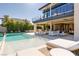Backyard swimming pool with sun loungers and a view of the luxury home at 4918 Summit Overlook Dr, Las Vegas, NV 89135