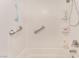 Clean bathroom featuring safety bars and toiletry shelves at 4938 Via Luis Ct, North Las Vegas, NV 89031