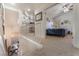 Upstairs bedroom featuring plush carpeting with plenty of natural light at 4938 Via Luis Ct, North Las Vegas, NV 89031
