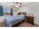 Bedroom with ceiling fan, wood furniture, and outside view at 4938 Via Luis Ct, North Las Vegas, NV 89031