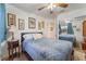 Bedroom with large mirror and ceiling fan above the bed at 4938 Via Luis Ct, North Las Vegas, NV 89031