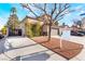 Charming home with a well-maintained yard, inviting facade, and 'For Sale' sign at 4938 Via Luis Ct, North Las Vegas, NV 89031