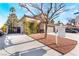 Charming home with a well-maintained yard, inviting facade, and 'For Sale' sign at 4938 Via Luis Ct, North Las Vegas, NV 89031