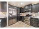 Spacious kitchen featuring stainless steel appliances and sleek countertops at 4938 Via Luis Ct, North Las Vegas, NV 89031