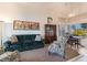 Inviting living room with a cozy seating arrangement and natural light from large windows at 4938 Via Luis Ct, North Las Vegas, NV 89031