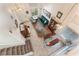 Bright, open-concept living space with tile floors, staircase, dining area, and comfortable seating at 4938 Via Luis Ct, North Las Vegas, NV 89031