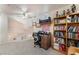 Bright loft featuring vaulted ceiling, ceiling fan, desk, and built in bookcase at 4938 Via Luis Ct, North Las Vegas, NV 89031