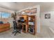 Comfortable home office featuring built-in desk and shelving at 4938 Via Luis Ct, North Las Vegas, NV 89031