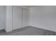Bedroom featuring neutral walls, gray flooring, and a closet with sliding doors at 501 National St, Henderson, NV 89015