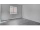 Neutral painted bedroom with a window and neutral paint at 501 National St, Henderson, NV 89015