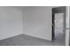 Bedroom with neutral walls, gray flooring, and an entry doorway at 501 National St, Henderson, NV 89015