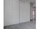 Large closet with multiple sliding doors and a light gray floor, leading to additional rooms at 501 National St, Henderson, NV 89015