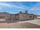 Charming home featuring stone landscaping, covered patios, and a blue sky at 501 National St, Henderson, NV 89015