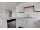 Bright kitchen with stainless steel dishwasher, granite countertops, and new cabinets at 501 National St, Henderson, NV 89015