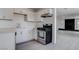 Well-lit kitchen with white cabinets and stainless steel appliances at 501 National St, Henderson, NV 89015