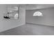 Open living room view, with kitchen pass-through and half-moon window feature at 501 National St, Henderson, NV 89015
