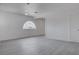Spacious living room features a half-moon window and neutral paint at 501 National St, Henderson, NV 89015