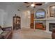 Inviting living room with a display cabinet, fireplace and ceiling fan at 5225 W Reno Ave # 137, Las Vegas, NV 89118