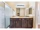 Bathroom featuring a double vanity with granite countertops at 5648 Alitak Bay St, North Las Vegas, NV 89081
