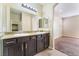 Bathroom featuring a double vanity with granite countertops and large mirror at 5648 Alitak Bay St, North Las Vegas, NV 89081