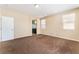 Large bedroom boasting neutral walls, plush carpet, and ensuite bathroom at 5648 Alitak Bay St, North Las Vegas, NV 89081