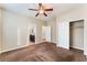 Bedroom with ceiling fan, carpet, and ensuite bathroom for added convenience at 5648 Alitak Bay St, North Las Vegas, NV 89081