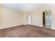 Spacious bedroom with plush carpet and an ensuite bathroom at 5648 Alitak Bay St, North Las Vegas, NV 89081
