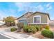 Inviting single-story home featuring a two-car garage and mature landscaping at 5648 Alitak Bay St, North Las Vegas, NV 89081