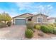 Charming single-story home with a paved driveway and desert landscaping at 5648 Alitak Bay St, North Las Vegas, NV 89081