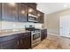 Modern kitchen boasts granite countertops, stainless steel appliances, and ample cabinetry at 5648 Alitak Bay St, North Las Vegas, NV 89081