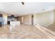 Open-concept living space features tile floors and lots of natural light at 5648 Alitak Bay St, North Las Vegas, NV 89081