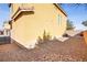 Backyard features low-maintenance desert landscaping and neutral-toned walls at 6121 Sinatra Sands Ct, Las Vegas, NV 89130