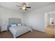 Bedroom features a ceiling fan and comfortable bed at 6121 Sinatra Sands Ct, Las Vegas, NV 89130