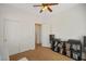 Bright bedroom with ceiling fan, closet, and media center for storage and organization at 6121 Sinatra Sands Ct, Las Vegas, NV 89130