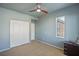 A bedroom with gray walls, carpet, and a ceiling fan at 6121 Sinatra Sands Ct, Las Vegas, NV 89130