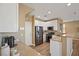 Bright kitchen features stainless steel appliances, stone countertops, and tile backsplash at 6121 Sinatra Sands Ct, Las Vegas, NV 89130