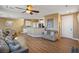 Open-concept living room featuring modern ceiling fan, hardwood floors and contemporary decor at 6121 Sinatra Sands Ct, Las Vegas, NV 89130