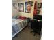 Bedroom featuring a bed, desk, computer, and multiple wall art pieces at 7200 Pirates Cove Rd # 1025, Las Vegas, NV 89145