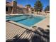 A community pool with blue water and secure fencing around the perimeter for safety at 7200 Pirates Cove Rd # 1025, Las Vegas, NV 89145