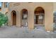 Backyard featuring a covered patio, a small garden, and desert landscaping at 820 Canterra St # 1054, Las Vegas, NV 89138