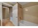 Bathroom with tub, shower and white door at 820 Canterra St # 1054, Las Vegas, NV 89138