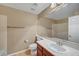 Bathroom featuring single sink vanity, large mirror, and tile floors at 820 Canterra St # 1054, Las Vegas, NV 89138