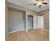 Neutral bedroom showcasing closet with sliding doors and wood flooring at 820 Canterra St # 1054, Las Vegas, NV 89138