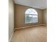 Bright bedroom with bamboo flooring, neutral paint and a large arched window at 820 Canterra St # 1054, Las Vegas, NV 89138