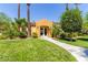 Community clubhouse surrounded by lush landscaping and green lawn at 820 Canterra St # 1054, Las Vegas, NV 89138