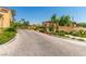 Brick paved entrance to community with privacy gate, well-maintained desert landscaping at 820 Canterra St # 1054, Las Vegas, NV 89138