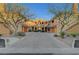 Charming townhouse featuring a terra cotta roof, decorative windows, and lovely desert landscaping at 820 Canterra St # 1054, Las Vegas, NV 89138