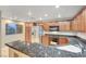 Gourmet kitchen with granite countertops, stainless steel appliances, and ample cabinet space at 820 Canterra St # 1054, Las Vegas, NV 89138